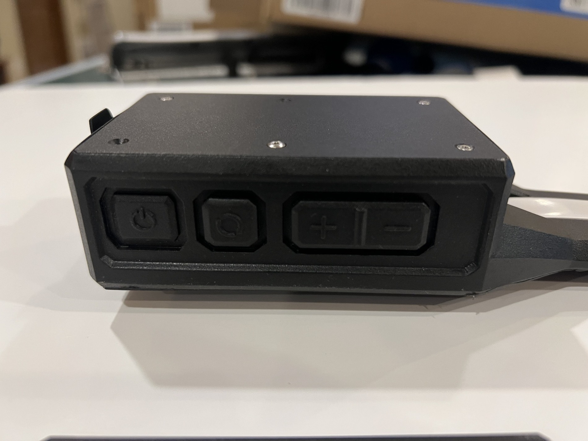 Close photograph of the recessed control cluster on the Orion Belt housing
