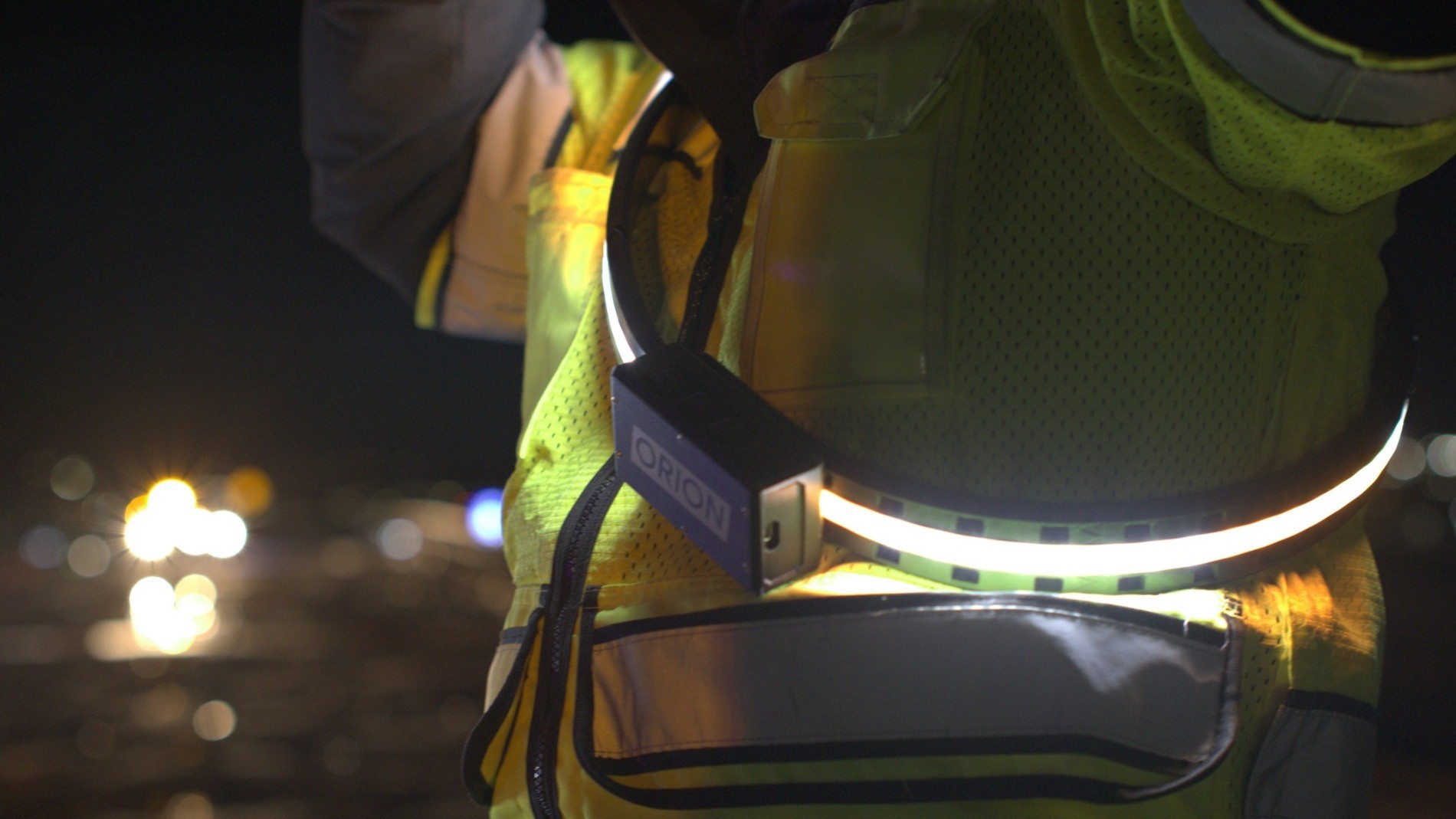 Close view of an illuminated Orion Belt worn with high visibility workwear